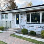 Ranch style house with new windows and exposed house wrap, mid- exterior renovation project with 12 Penny Exteriors